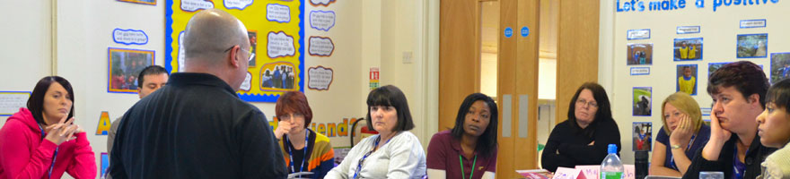 A first aid training course being taught in a school